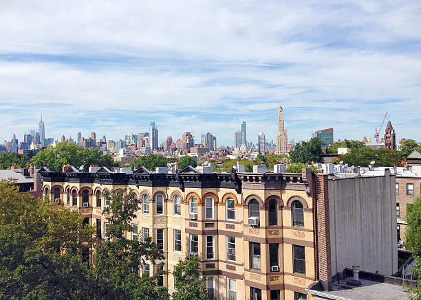 Skyline of Manhattan from Park Slope, Brooklyn View of the Manhattan skyline from a rooftop in Park Slope, Brooklyn brooklyn new york stock pictures, royalty-free photos & images