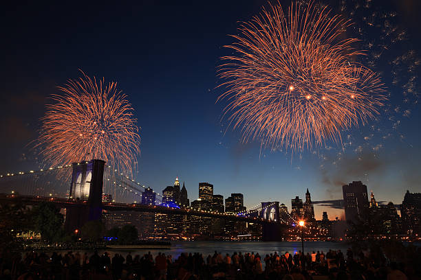 Skyline of New York at night with fireworks stock photo