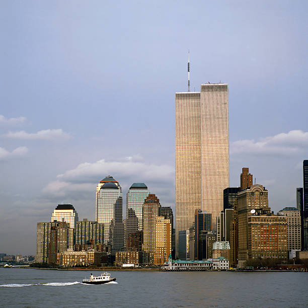 NYC Skyline With The Twin Towers The NYC skyline with the World Trade Center seen from NJ world trade center manhattan stock pictures, royalty-free photos & images