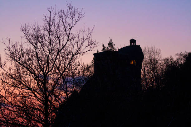 Skyscape in Sunset, Trees and A Monastery on the Top of the Rocks Between the Mountainsand stock photo