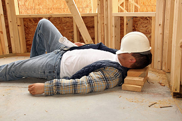 Sleeping man in construction site stock photo