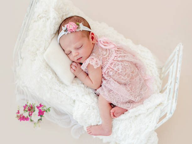 Sleeping newborn baby girl stock photo