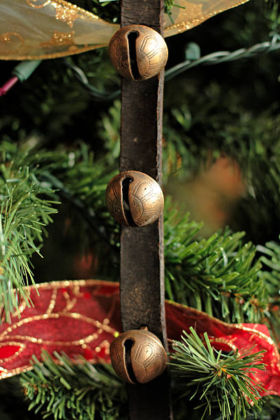 Sleigh Bells hanging on the tree stock photo