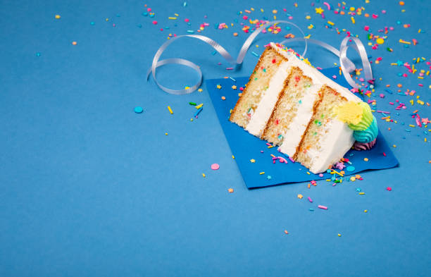 Slice of Birthday Cake on blue stock photo