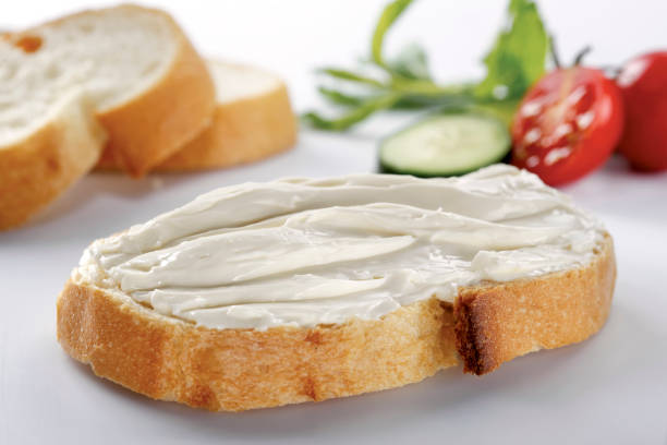 slice of bread with cream cheese (selective focus) slice of bread with cream cheese (selective focus) crostini photos stock pictures, royalty-free photos & images