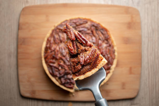 Slice of homemade Pecan Pie Food photography comfort food stock pictures, royalty-free photos & images