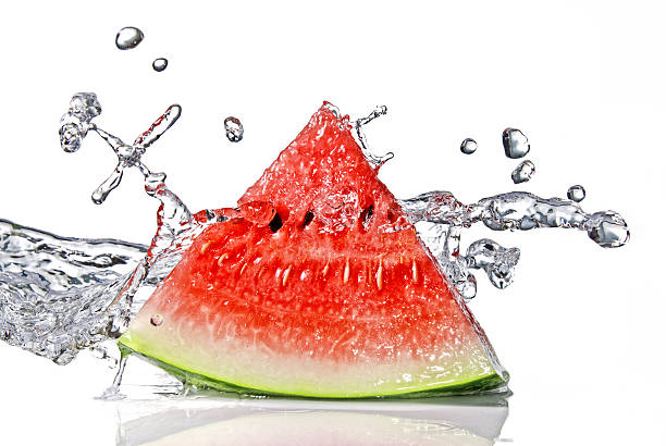 A slice of watermelon with a water splash stock photo