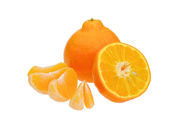 A sliced and segmented orange on a white background stock photo