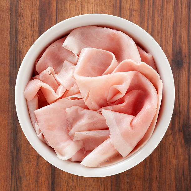 Sliced ham Top view of white bowl full of sliced ham ham stock pictures, royalty-free photos & images
