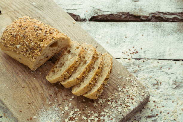 Sliced homemade gluten free bread on cutting board stock photo