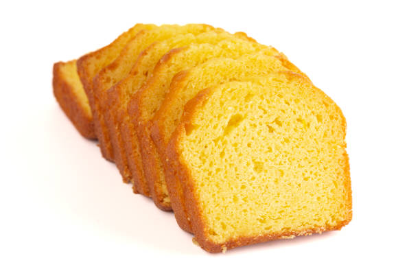 Sliced Lemon Cake Isolated on a White Background stock photo