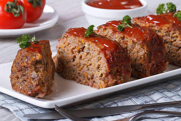sliced meat loaf with ketchup and parsley close-up - meat loaf 個照片及圖片檔