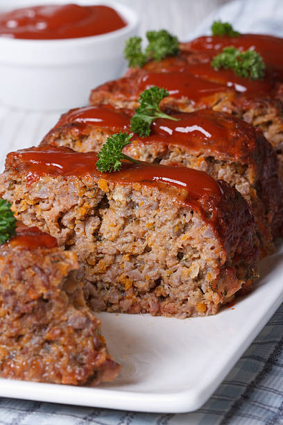 sliced meat loaf with ketchup and parsley close-up - meat loaf 個照片及圖片檔