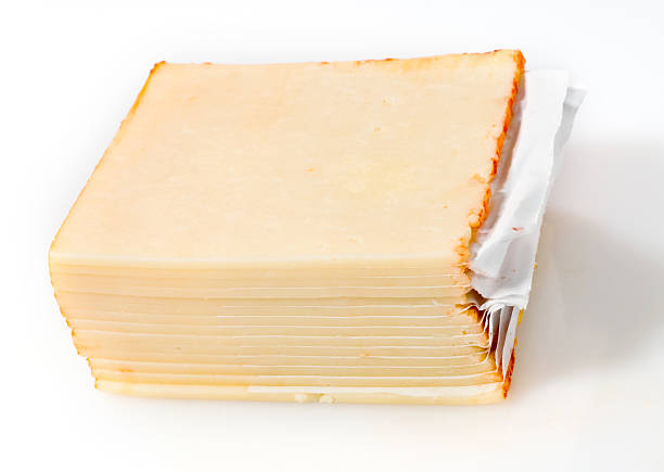 Sliced muenster cheese Sliced muenster cheese on white background muenster cheese stock pictures, royalty-free photos & images
