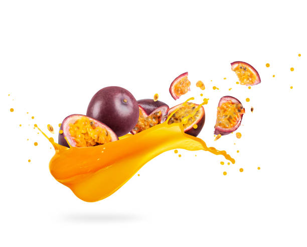 sliced ripe passion fruits with splashes of fresh juice on a white background - granadilla imagens e fotografias de stock