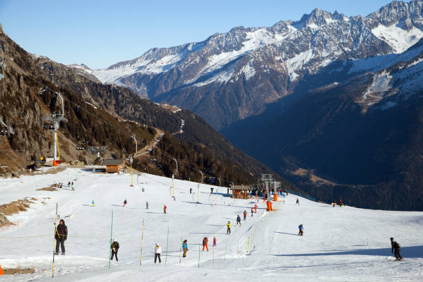 A slope with t-bar lift on mountain ski resort Chamonix: A slope with t-bar lift on mountain ski resort t bar ski lift stock pictures, royalty-free photos & images