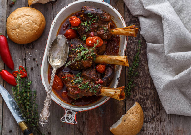 Slowly cooked lamb with tomato sauce and bread, turkish cuisine stock photo