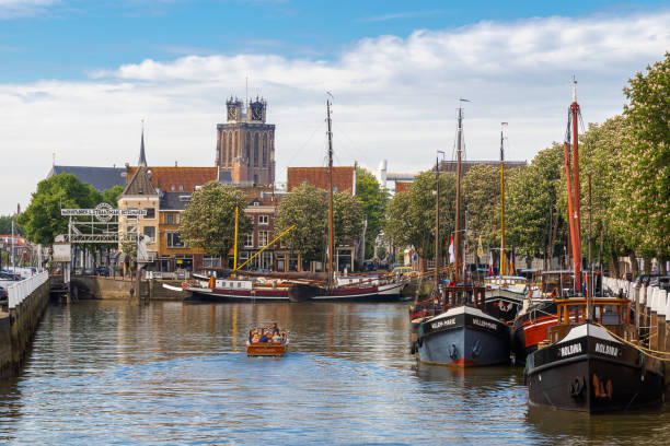 Small boat sailing in the New Harbor in Dordrecht, Holland stock photo