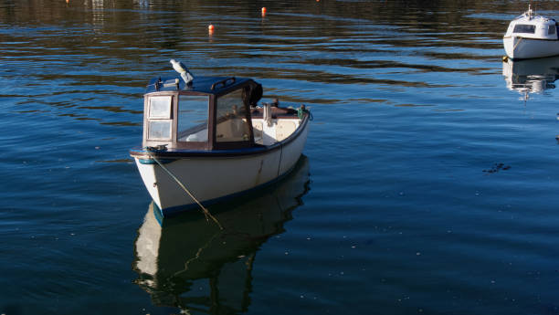 Small boats in winter sun stock photo