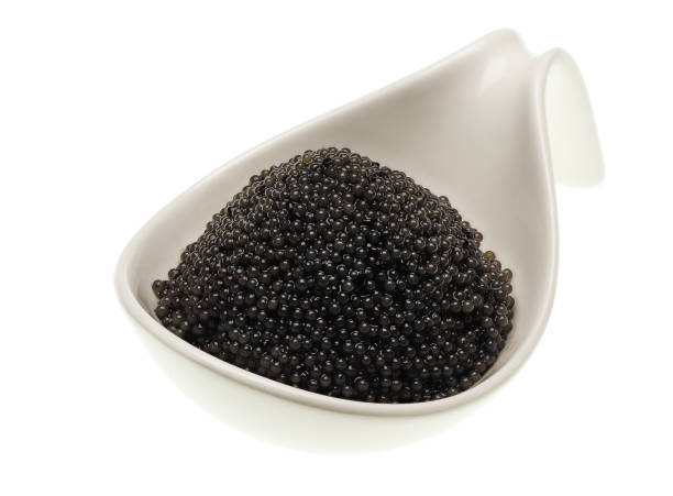 A small bowl of black lumpfish roe, a cheap caviar alternative stock photo