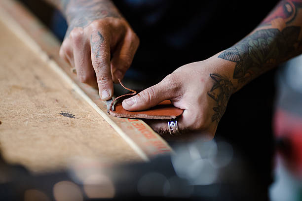 Small Business Owner Making Leather Products in His Shop stock photo