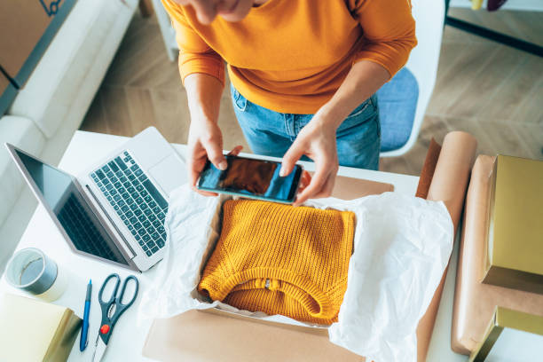 Small business owner Young woman are preparing a package for delivery to clients. Online clothing store social media photos stock pictures, royalty-free photos & images