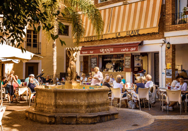 Small café at Plaza Higuitos in the centre of Almunecar Small café at Plaza Higuitos in the centre of Almunecar with a fountain in the middle. granada spain stock pictures, royalty-free photos & images