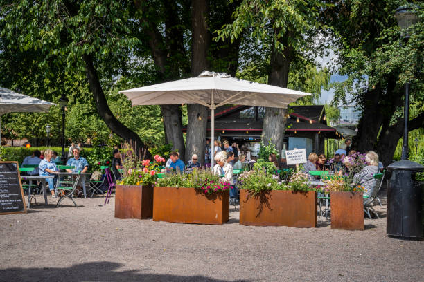Small cafe with guests in a public city garden in Stockholm. stock photo
