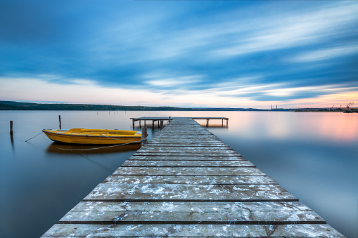 small dock and boat at the lake stock photo - download