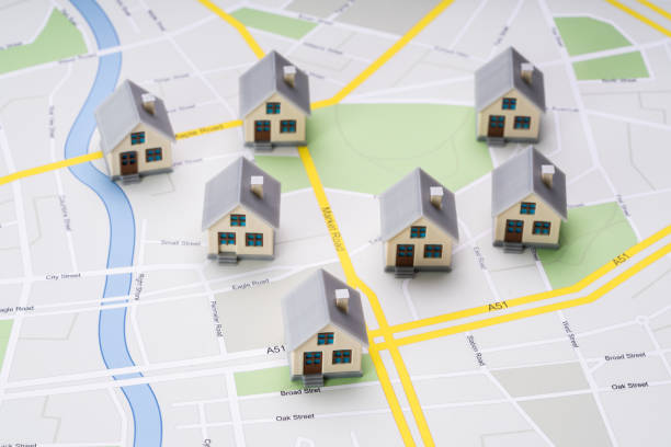 Small House Models On Map High Angle View Of Small House Models Over Road Route Map real estate stock pictures, royalty-free photos & images
