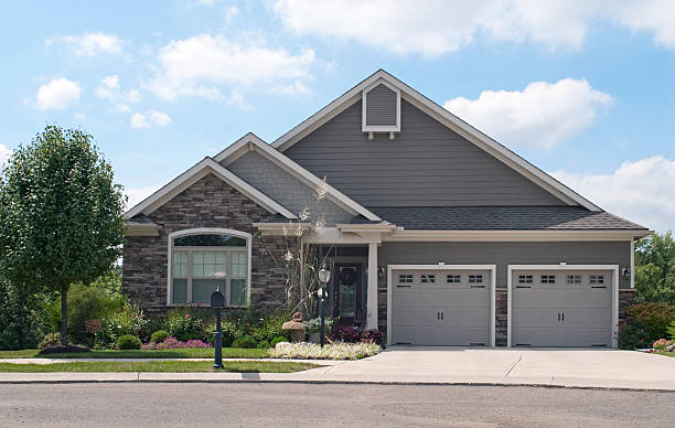 Small House with Two Car Garage Small suburban house with two-car garage. stone house stock pictures, royalty-free photos & images