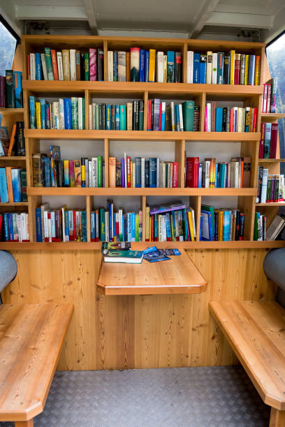 Small Library Cabin With Colorful Books, Table And Benches stock photo
