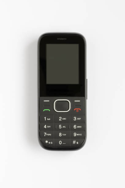 Small Old Black Mobile Phone - On White Background stock photo