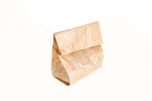 Small paper bag isolated on white background. Grocery bag