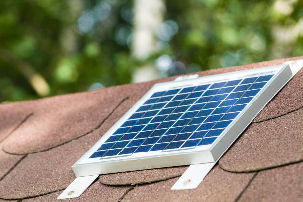 Small photovoltaic battery on bower roof, alternative energy. stock photo