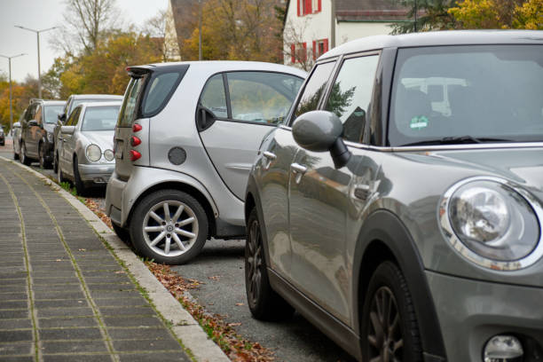 A small Smart Fortwo car cross parking in a street stock photo