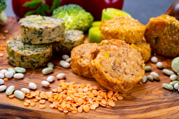 Small tasty vegan and vegetarian burgers made from fresh vegetables and dried legumes and beans stock photo
