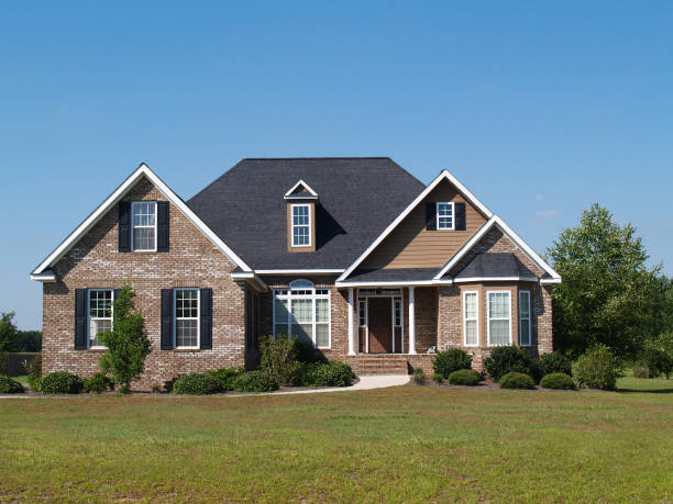 Small Two Story Brick Home with Garage and Porch stock photo