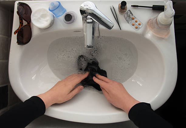 Best Washing Clothes In Sink Stock Photos Pictures