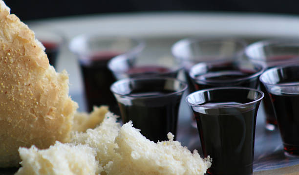 Small Wine Cups and Broken Bread for Communion stock photo