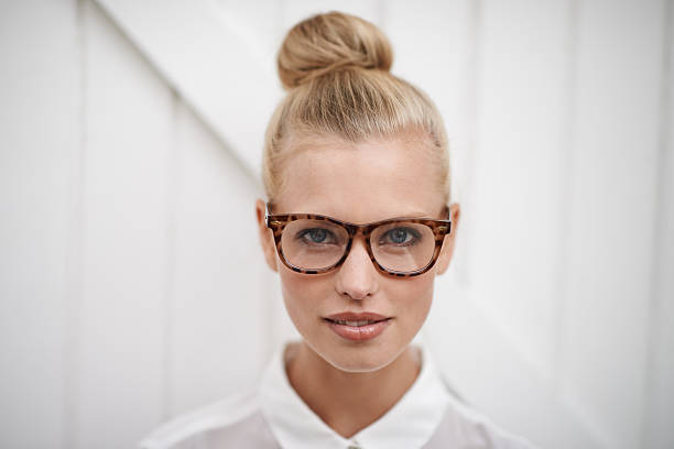 Smart casual A young woman wearing a blouse and spectacles eyewear stock pictures, royalty-free photos & images