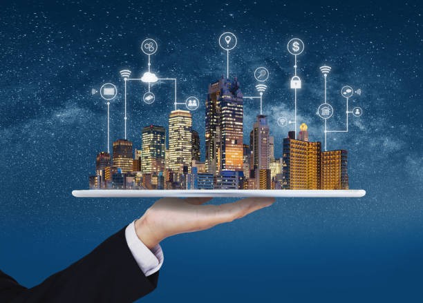 Smart city, building technology, and real estate business. Businessman holding digital tablet with buildings hologram and application programming interface technology  smart city stock pictures, royalty-free photos & images