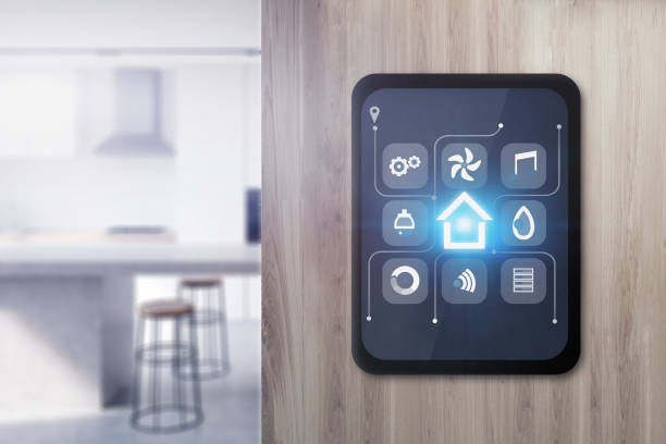 Smart home icons on tablet in kitchen Glowing smart home icons on tablet computer screen attached to wooden wall in blurred kitchen. Concept of automation and internet of things. 3d rendering illustration. home automation stock pictures, royalty-free photos & images