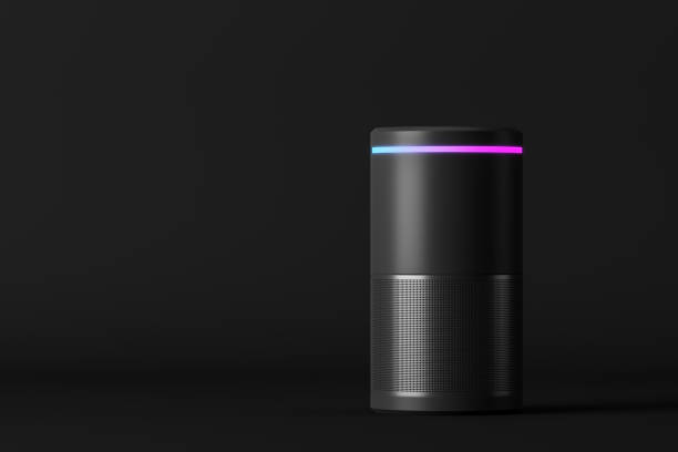 Smart speaker on black background Voice controlled smart speaker standing over black background. Concept of technology and electronics. 3d rendering mock up speech recognition stock pictures, royalty-free photos & images