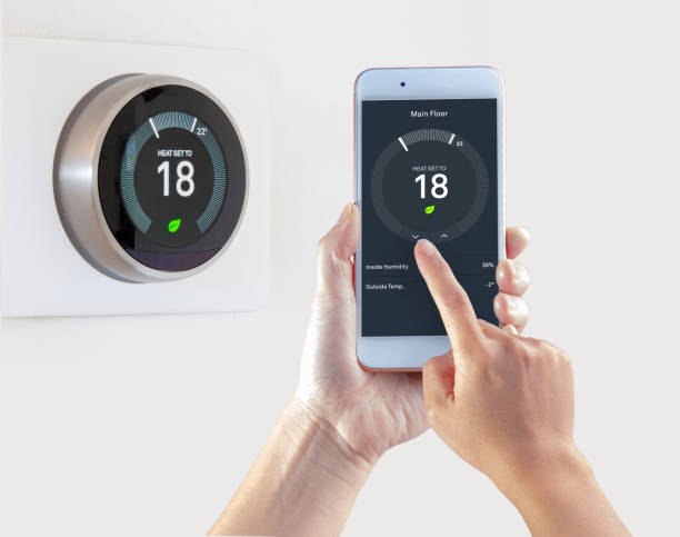 smart-thermostat-with-a-person-saving-energy-with-a-smart-device-on-a-picture-id1192217349?k=6&m=1192217349&s=612x612&w=0&h=VdxrXzrgn1YjyQqJTq30tfVXzMAZV5s8-kNR-G0ucbc= A Guide For Your Smart Home Essentials. Benefits and Tips