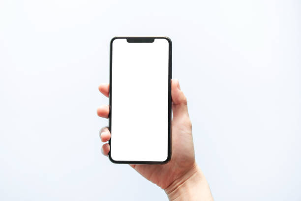 smartphone mockup. hand holding black phone white screen. isolated on white background. mobile phone frameless design concept. - hand imagens e fotografias de stock