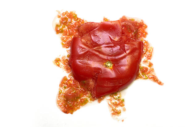 smash tomato - bad tomato stock photos and pictures.