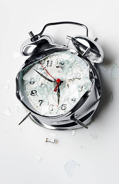 Smashed alarm clock stock photo