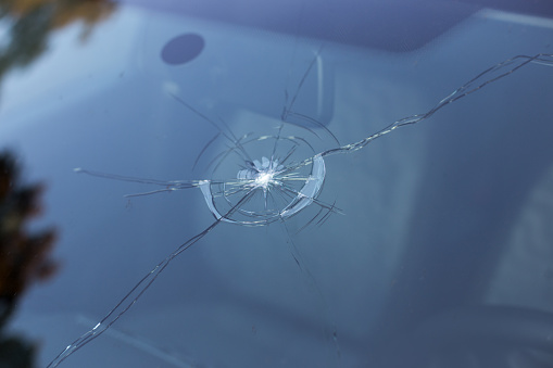 Smashed windscreen of a car, damaged glass