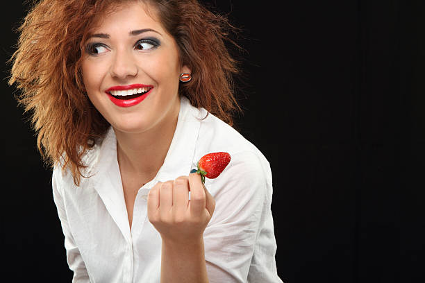 Smile and strawberries stock photo